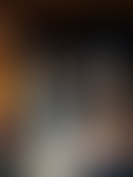 LGBTQ+ wedding ceremony led by Kickass Gatherings. The couple are both wearing white dresses and face each other during the vowel readings. Kickass Gatherings are an LGBTQ+ friendly wedding supplier, part of the Rebel Love Directory.