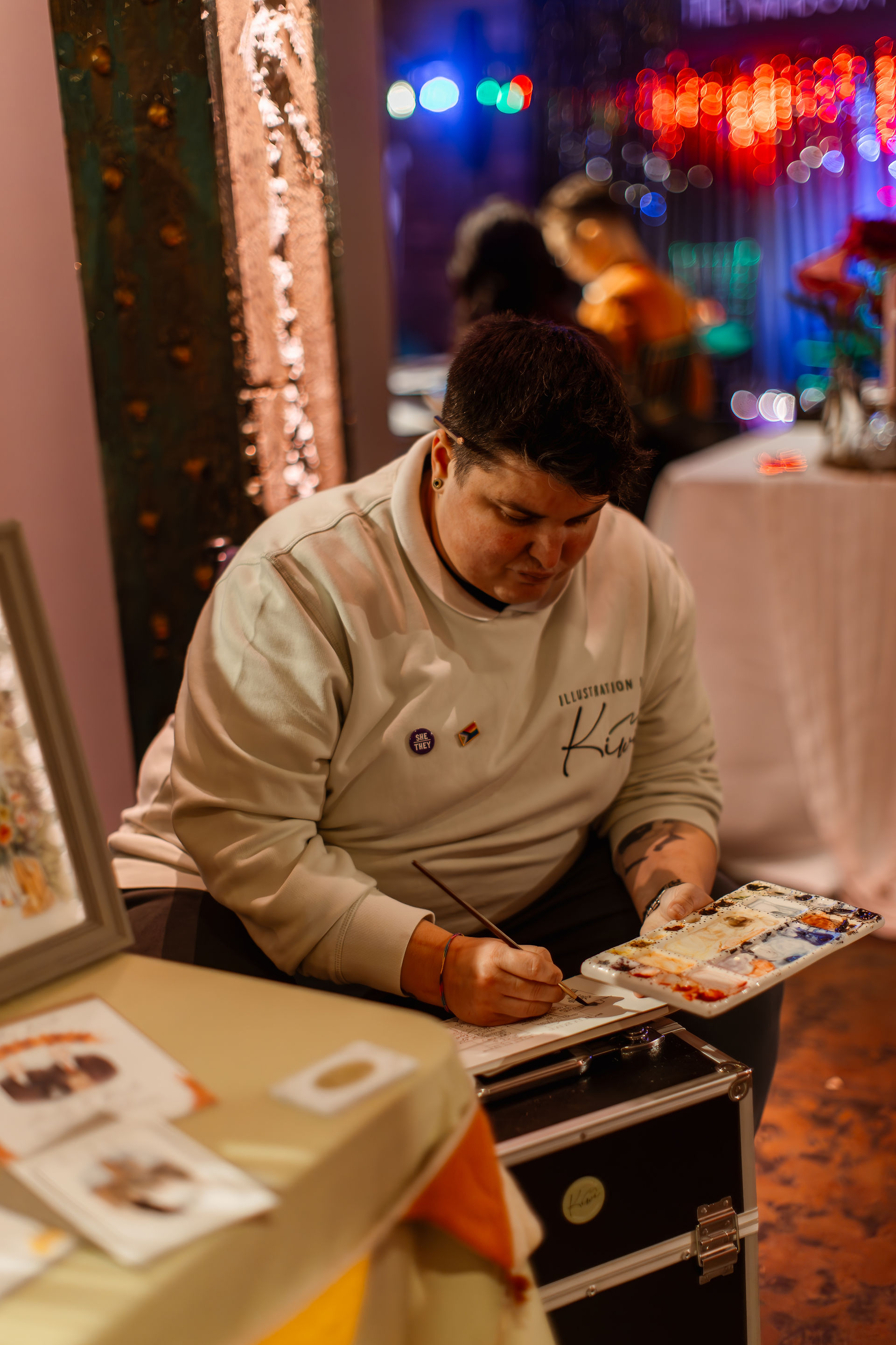 LGBTQ+ couples browsing the LGBTQ+ inclusive wedding suppliers at Rebel Love Wedding Fair