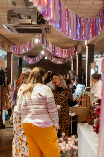LGBTQ+ to0be-weds looking at wedding supplier stalls at Rebel Love Wedding Fair