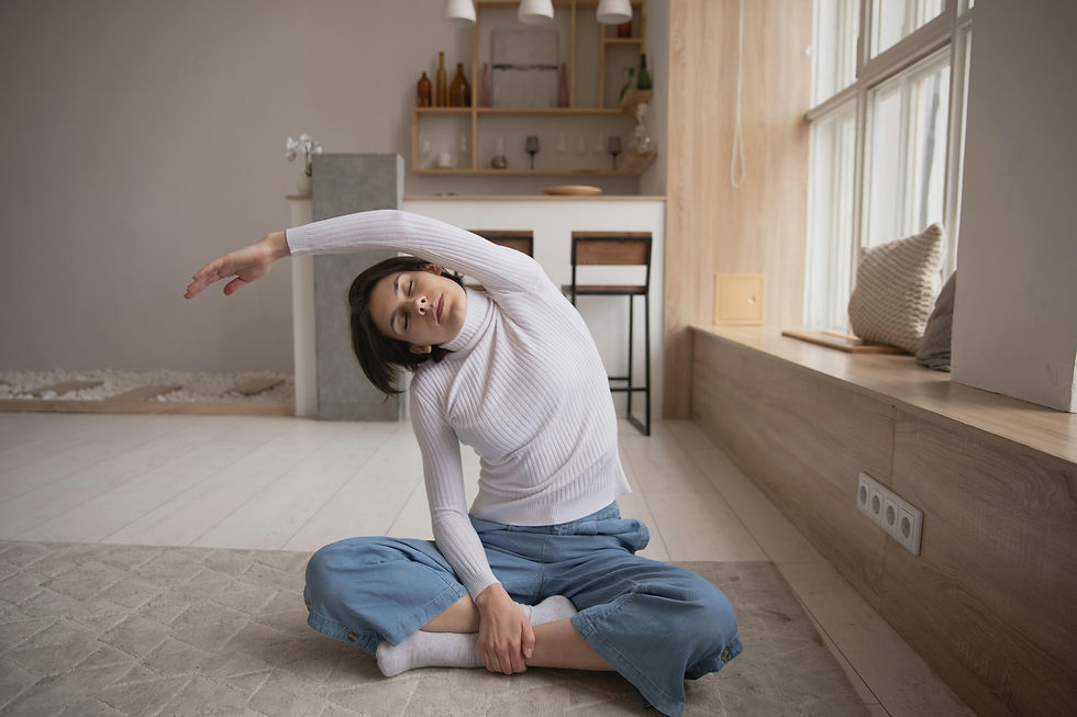 Woman sitting on the floor stretching