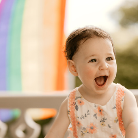 Smiling child outside during milestone session in CT