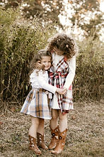 Siblings embracing in outdoor family session in Wilton, CT