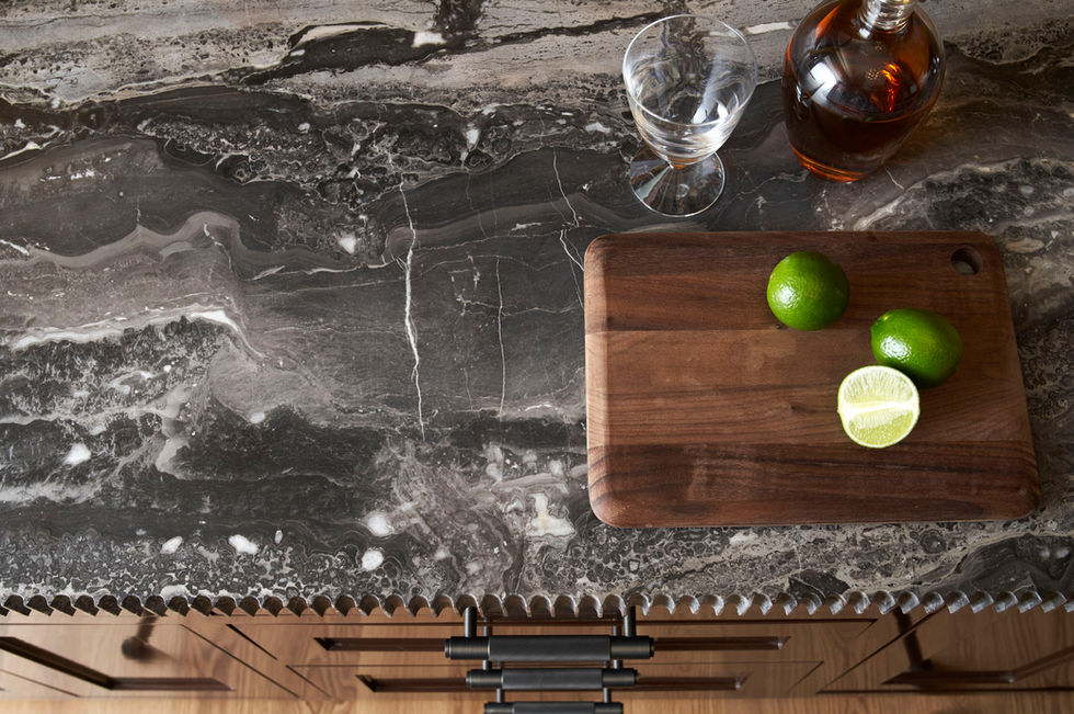 A close-up view of the sleek, modern bar area with elegant lighting and luxurious finishes.