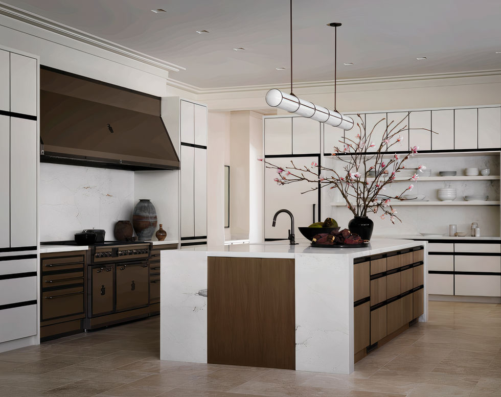 A modern kitchen with Calacatta marble in the island, featuring integrated shelves, full-height backsplashes, and a waterfall island. The kitchen includes white cabinetry with black handles and warm wood accents. Above the island, two sleek light fixtures hang, and a decorative branch with blossoms is placed on the island. The space is filled with natural light.