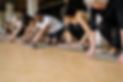 Diverse Yoga Students Unrolling Mats