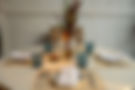 Dining table set for four with plant centerpiece