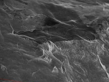 Scalable and passive carbon nanotube thin-film sensor for detecting micro-strains and potential impact damage in fiber-reinforced composite materials