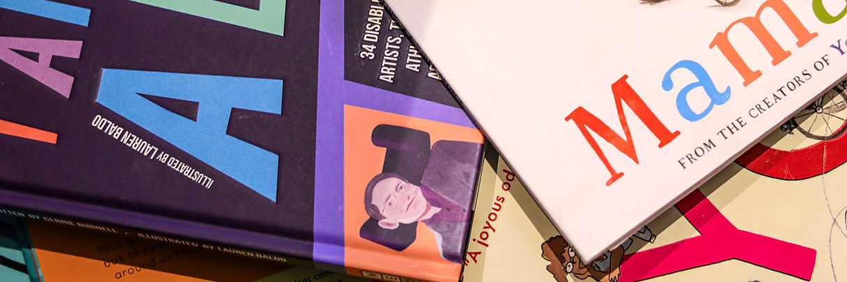 a pile of children's books featuring disabled characters