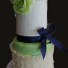 Three Tier Ruffled Wedding Cake with Blue Bow 