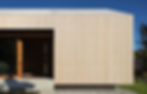 Sustainable timber cabin with a warm roof system, featuring weather-resistant cladding and high-performance insulation.