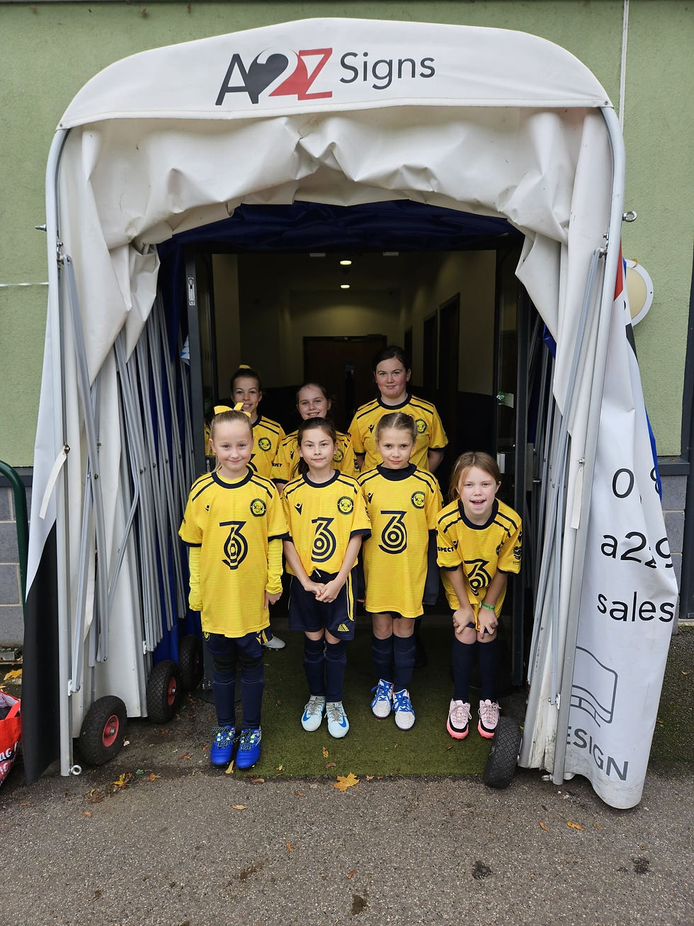 Launton girls lined up in the tunnel as Oxford City mascots