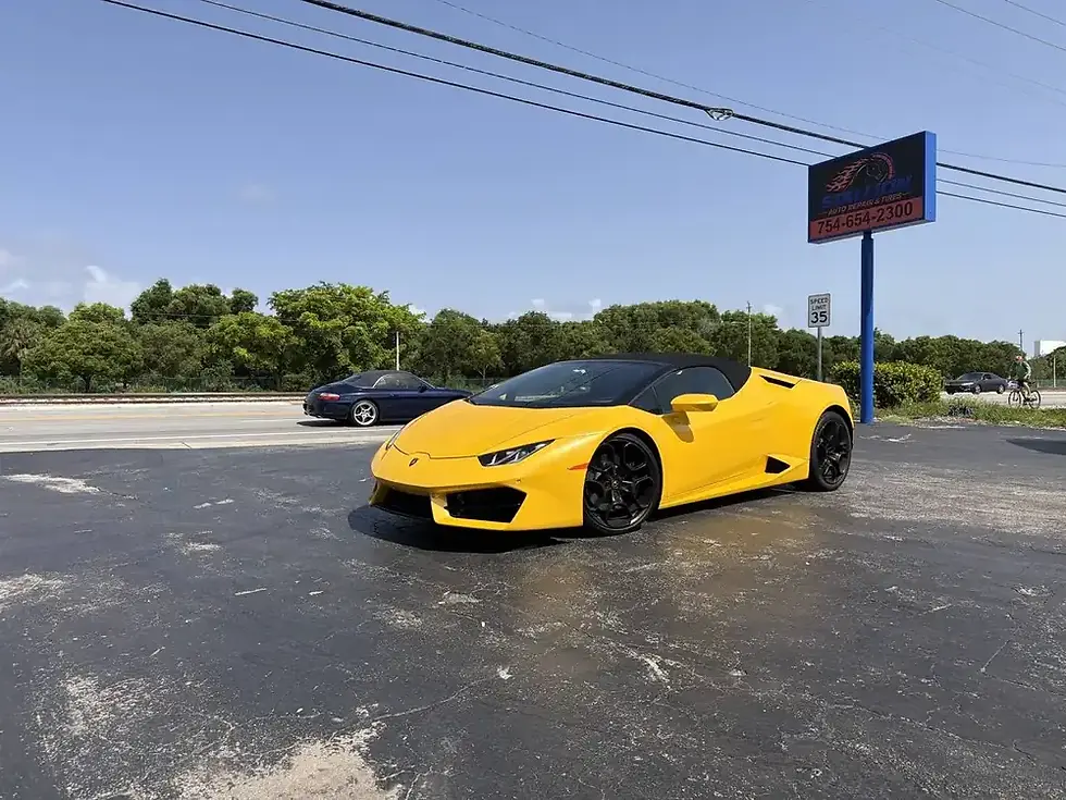 Yellow Lamborghini Huracan Spyder at Stallion Auto Repair, N Dixie Hwy, Pompano Beach