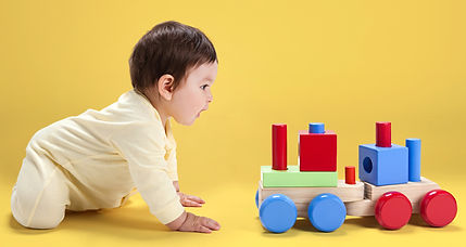 Baby with Wooden Toy_edited.jpg