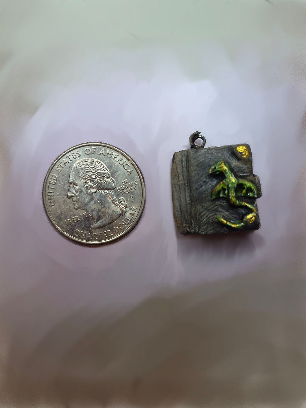 Thumbnail: Handmade ceramic Summon Dragon miniature book beside a quarter for size reference