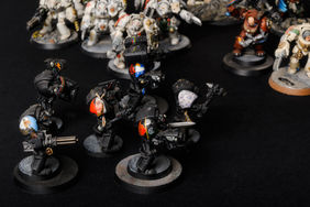 a unit of six rogue trader dark angels terminators painted in black with native americans paintings on the shoulder pads. metal warhammer 40k, vintage, OOP, painted miniatures by the artist Hawk Talon.