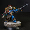 An Ultramarine's Space Marine Champion from Marneus Calgar's 2008 Honour Guard metal box set painted by artist Hawk Talon