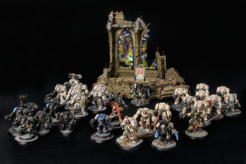 3 squads of deathwing terminators next a chapel of sanctuary and 2 Commanders, a Librarian, a Chaplain, an Apothecary, a Techmarine, a Standar bearer, 1st Company Dark Angels command squad. Painted by Hawk Talon.