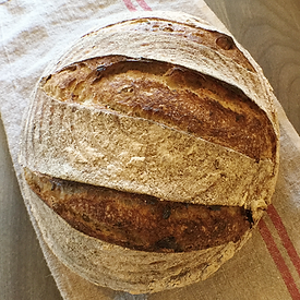 brown bear baking tuscan olive boule - red winter wheat, rosemary, toasted hazelnuts, cured olives, lemon zest, natural levain culture, sea salt. a taste of the tuscan countryside.