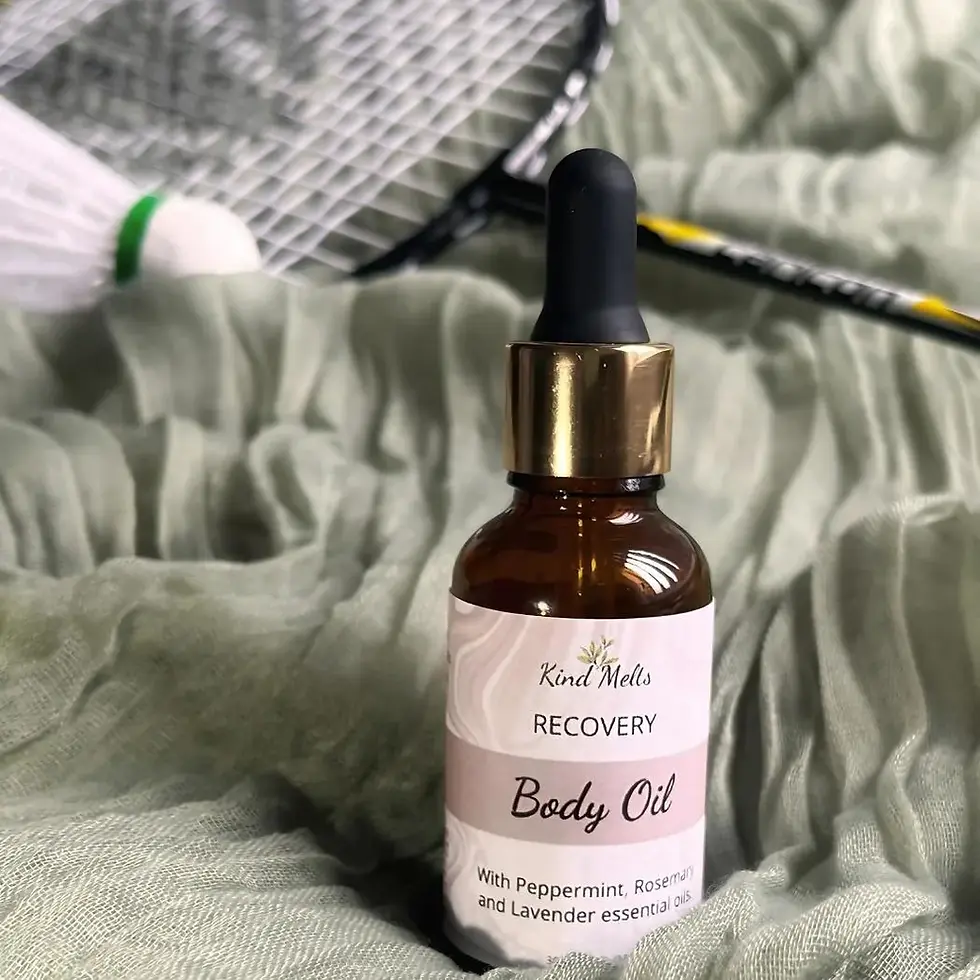 natural body massage oil for recovery with sports equipment in background