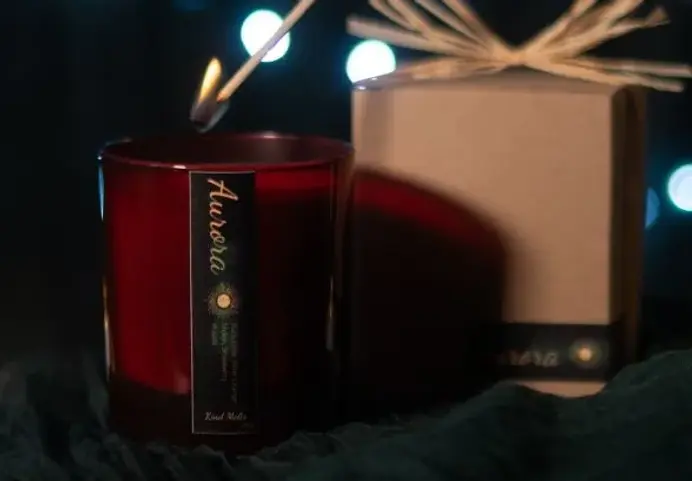 eco home fragrance wooden wick candle and candle gift box in background.