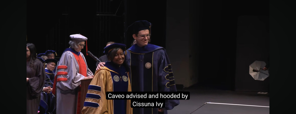 Dr. Ivey hoods Dr. Quevedo