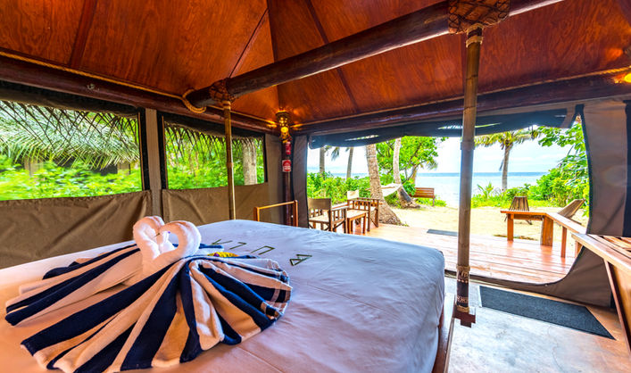 Beachfront Adi (Queen) Bure interior Barefoot Manta Island Resort Fiji.jpg