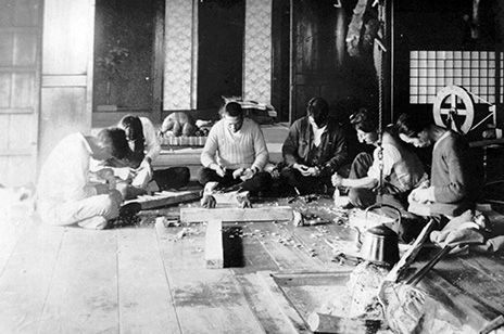 Workers carve wooden bears at the Tokugawa Farm