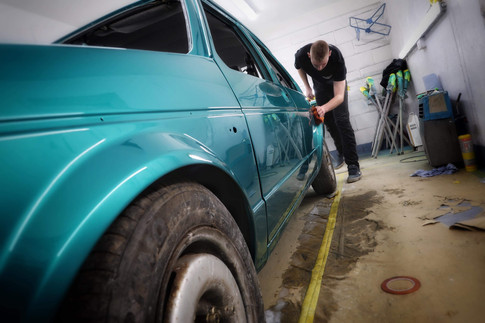 Steve Swann carrying out final polishing on MK1 Golf after respray