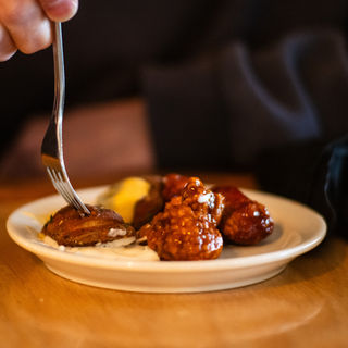 Fork picking up food from a plate at Elpedio's Ristorante. Delicious and tempting meals.