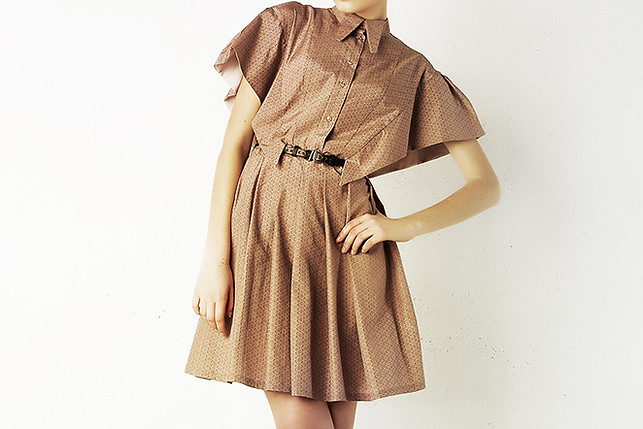 Model in brown silk dress