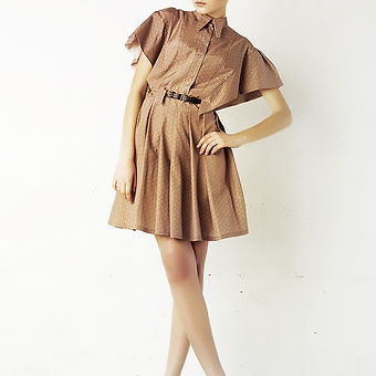 Model in brown silk dress