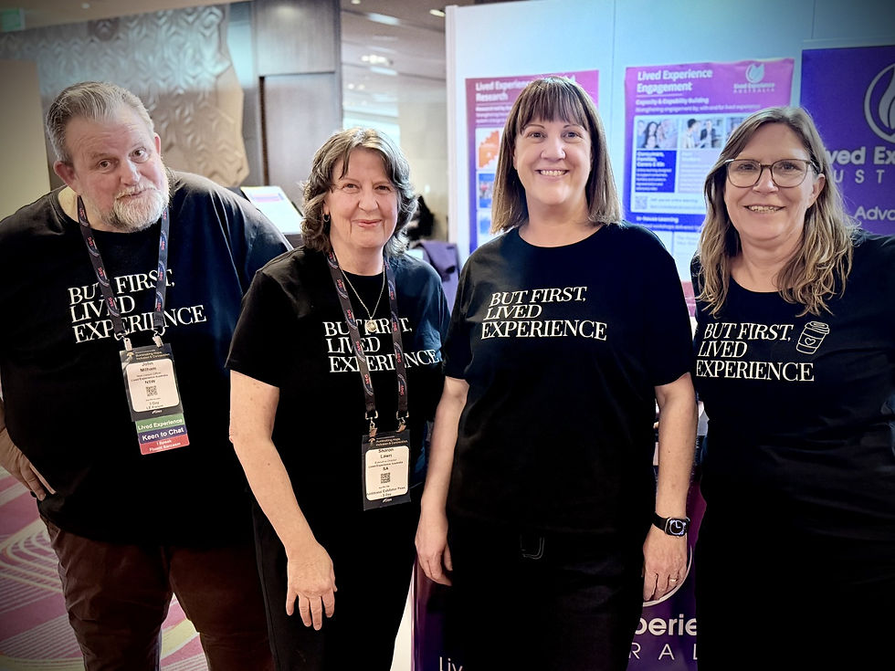 LEA team at our booth at TheMHS Conference Exhibitions - sporting our "But first, lived experience" shirts...