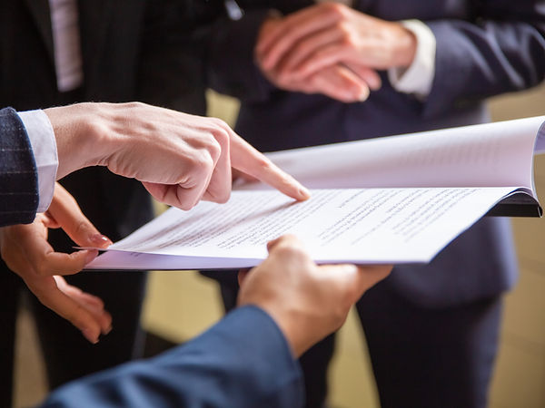 cropped-view-businesswomen-reading-document.jpg