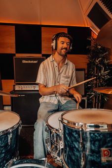 A drummer playing on the kit at Studio 54 recording studio in Exeter