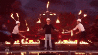People juggling fire and keeping plates on fire spinning