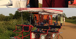 A group riding a four-wheeled Chuckle Bike on the path by the lake at Fairlop Waters