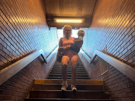 Walking down the stairs to the Subway in Astoria.
