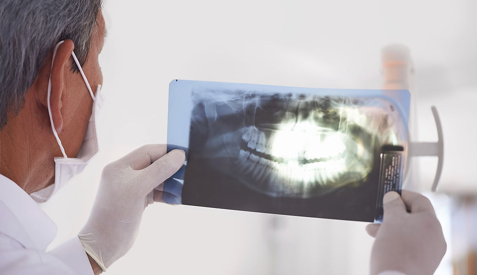 Dentist holding X-ray_edited.jpg