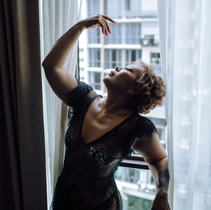 Woman posing confidently during her boudoir photography session at The Pin-up Rebels in Singapore