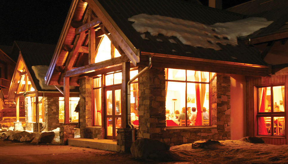 Front of Hotel L'Aigle at night 
