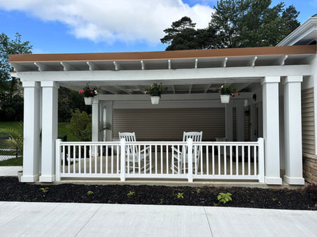 Covered outdoor patio at Evergreen Gardens assisted living in Strongsville, Ohio, offering residents a peaceful space to relax and socialize.