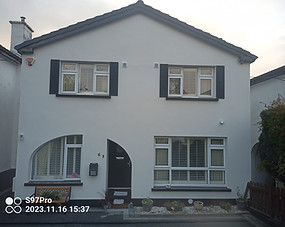 Detached home with off white acrylic render finish