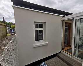 Extension with light cream acrylic render finish
