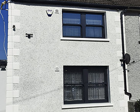 Semi-detached house with white dash render finish