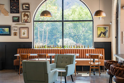Modern wine bar interior at The Humble Somm in Temecula featuring warm lighting, wood accents, and an inviting lounge atmosphere.