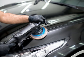 Car detailing with an electronic wheel on hood of car