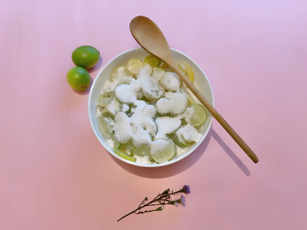 sliced limes and sugar mixed together