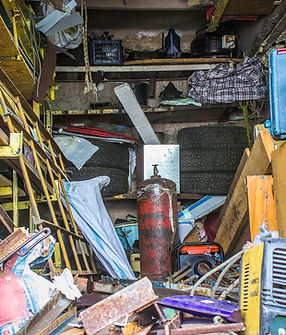 Big mess in an over stuffed suburban garage..jpg