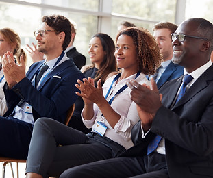 smiling-audience-applauding-at-a-business-seminar-2024-10-19-10-08-27-utc.jpg