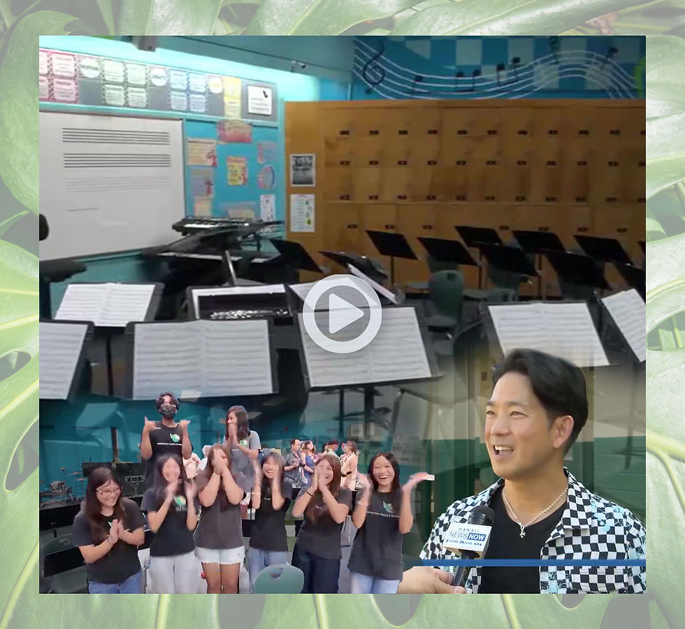 Jake Shimabukuro along with students celebrate the newly renovated band room. Fresh new paint and art cover the walls along with new furniture and lockers.